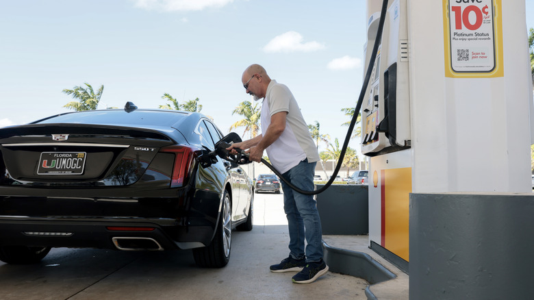 Pierre Boulos fills his vehicle with fuel at a gas station on April 13, 2026 in Miami, Florida.