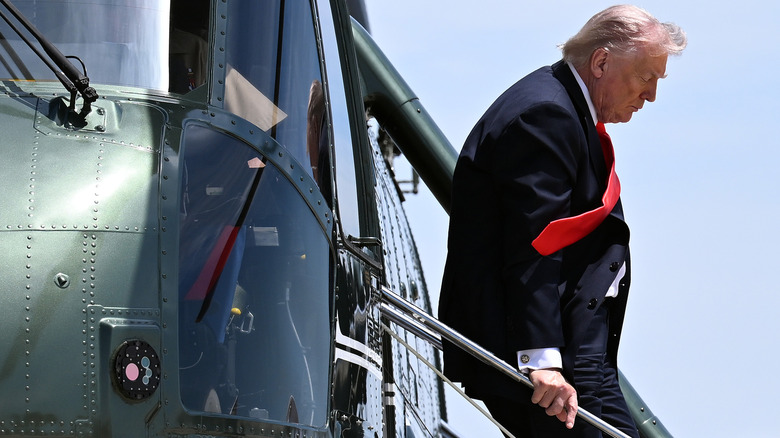 U.S. President Donald Trump disembarks Marine One as he arrives to board Air Force One on May 01, 2026 at Joint Base Andrews, Maryland