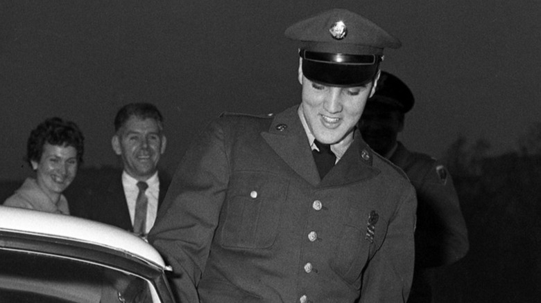 Elvis Presley getting into his BMW 507 in Friedberg Germany.