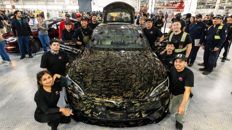 The final Tesla Model S covered in Tesla employee signatures.