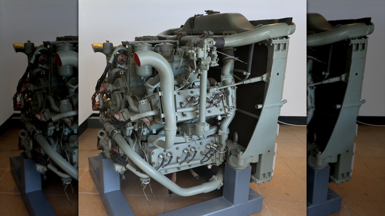 A Chrysler A57 Multibank engine on display in a room.