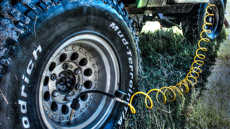 An on-board compressor inflates a tire.