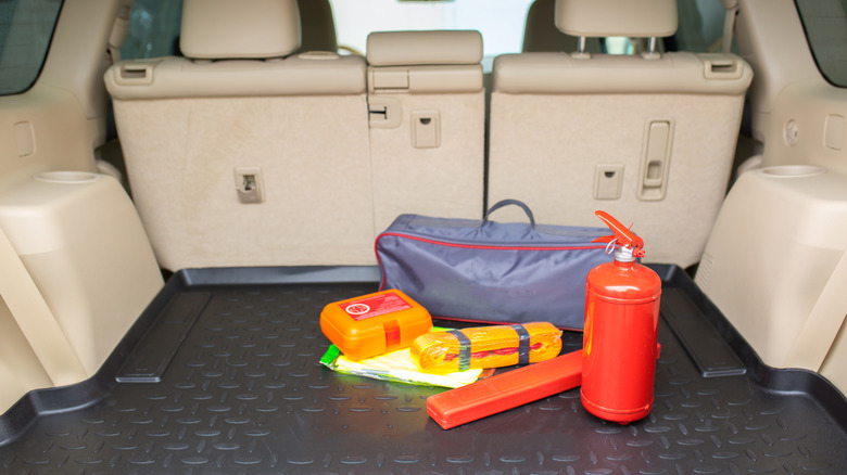Recovery gear is stowed in the back of a vehicle.