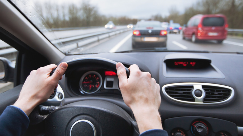 View from the driver's seat of a car stuck in highway traffic