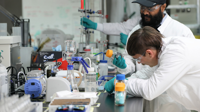 Redwood Materials employees doing science to recycle old batteries