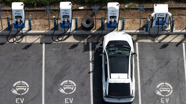 Lineup of EVgo chargers with one car charging