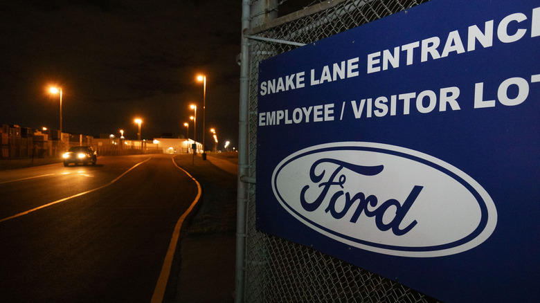 A vehicle exits out of the Ford Windsor Engine Plant as negotiations continue past the 11:59pm strike deadline on September 19, 2023 in Windsor, Canada.