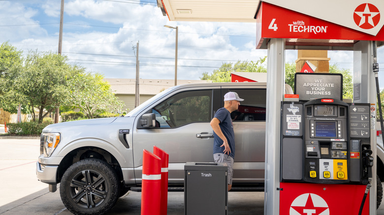 A person pumps gas at a Texaco gas station on July 10, 2026 in Austin, Texas.