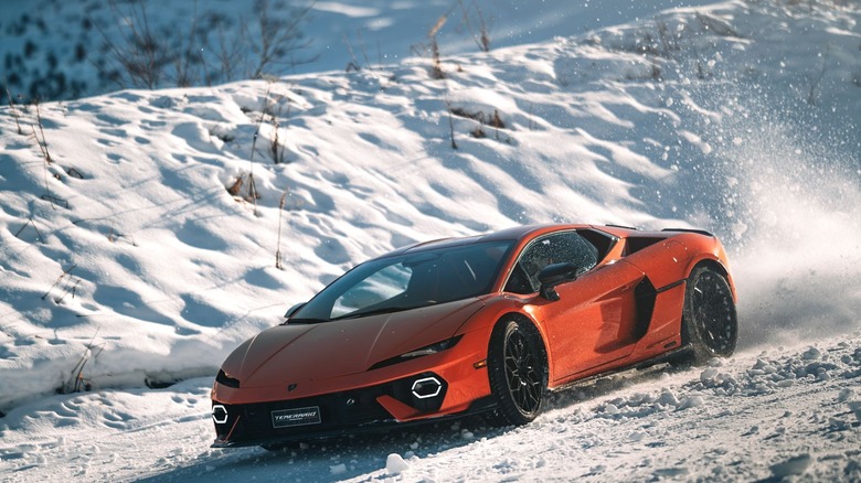 An orange Lamborghini in the snow