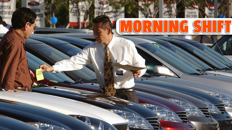 Salesmen Victor Zeng (right) assists customer Gary Zhao from Los Angeles at Toyota dealership while shopping for a new vehicle, January 31, 2005 in El Monte, California. The dealership has a sales staff that speaks more than 30 languages to assist customers.