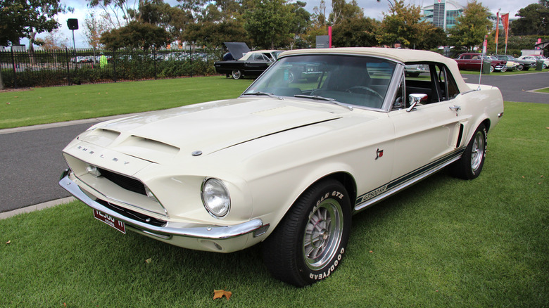 A 1968 Ford Mustang Shelby Cobra GT500KR convertible on grass