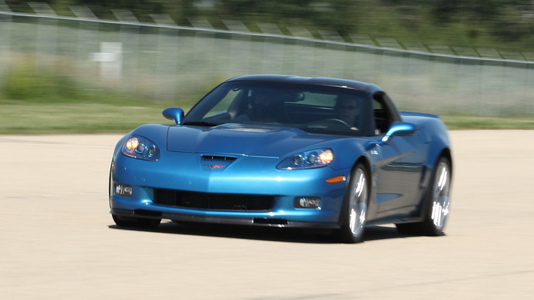 A blue C6 Corvette ZR1 driving down the road.