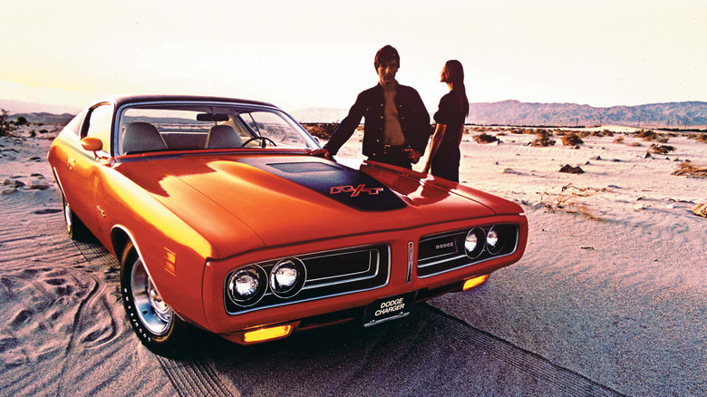 1971 Dodge Charger R/T front 3/4 view with a couple standing next to it