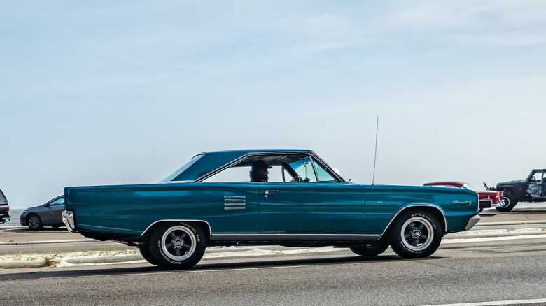 Wide angle side view of a 1966 Dodge Coronet 500 Hardtop Coupe at a local car show.