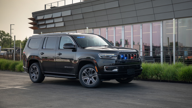 Jeep Wagoneer parked by a building