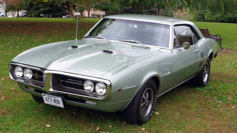 1967 Pontiac Firebird 400 coupe in gray parked outside.