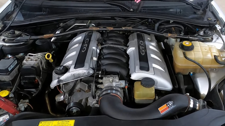 A close-up shot shows an LS1 V8 with GTO branding visible.