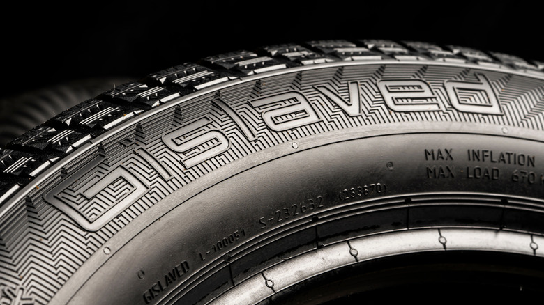 The Gislaved logo seen on a tire against black background.