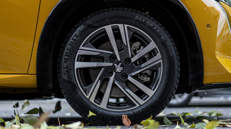 Semperit all-season tires on a yellow car.