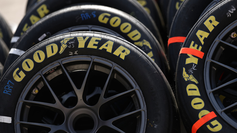 Close up of a pile of Goodyear race tires.