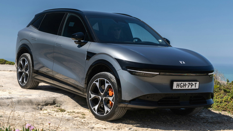 A tech Gray Zeekr 7X parked on a rugged, unpaved off-road surface