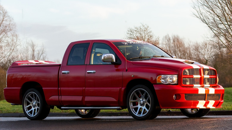 Side shot of a red Dodge Ram SRT-10 with white stripes