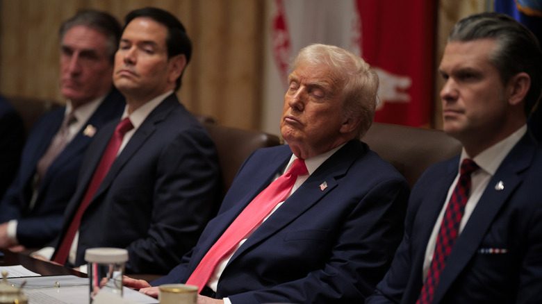 U.S. President Donald Trump attends a meeting of his Cabinet alongside (L-R) U.S. Interior Secretary Doug Burgum, U.S. Secretary of State Marco Rubio and U.S. Secretary of War Pete Hegseth in the Cabinet Room of the White House on December 02, 2025 in Washington, DC.