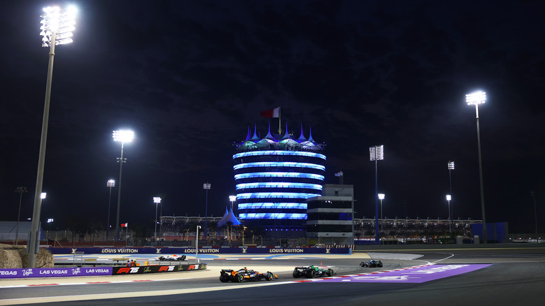Lance Stroll of Canada driving the (18) Aston Martin F1 Team AMR25 Mercedes leads Gabriel Bortoleto of Brazil driving the (5) Kick Sauber C45 Ferrari and Lando Norris of Great Britain driving the (4) McLaren MCL39 Mercedes on track during the F1 Grand Prix of Bahrain at Bahrain International Circuit on April 13, 2025 in Bahrain, Bahrain.