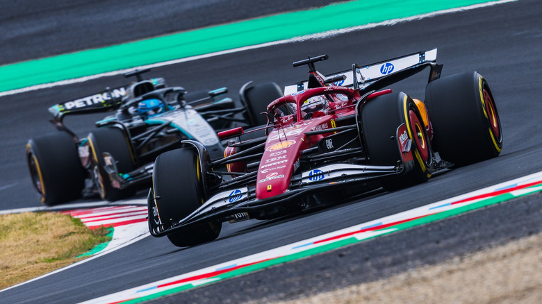 two F1 drivers racing on track