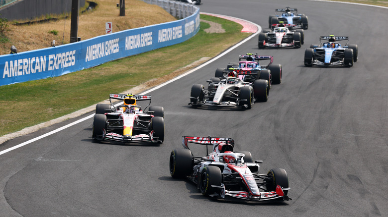 Esteban Ocon of France driving the (31) Haas F1 VF-26 Ferrari leads Liam Lawson of New Zealand driving the (30) Visa Cash App Racing Bulls VCARB 03 RB Ford on track during the F1 Grand Prix of Japan at Suzuka Circuit on March 29, 2026 in Suzuka, Japan.