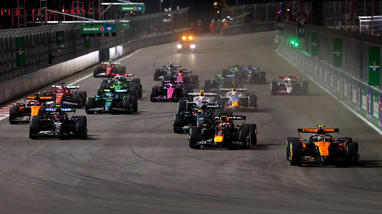 Lando Norris of Great Britain driving the (4) McLaren MCL39 Mercedes leads Max Verstappen of the Netherlands driving the (1) Oracle Red Bull Racing RB21 and the rest of the field at the start during the F1 Grand Prix of Las Vegas at Las Vegas Strip Circuit on November 22, 2025 in Las Vegas, Nevada.