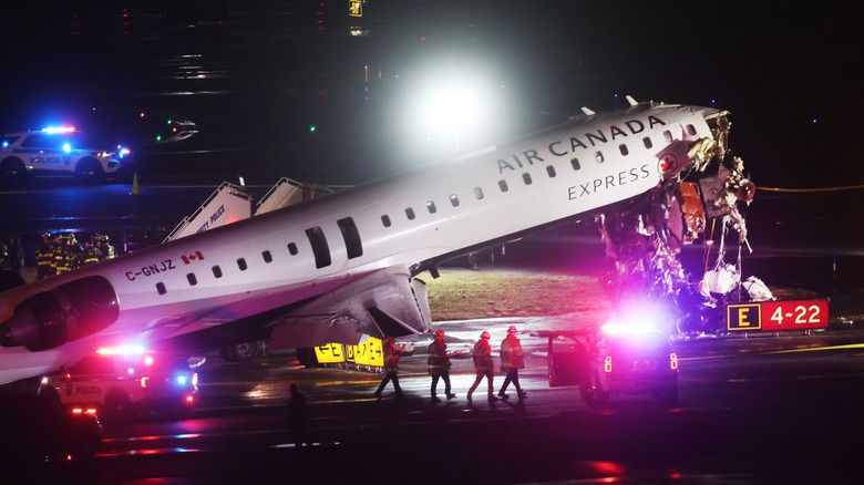 An Air Canada Express plane sits on the tarmac after it collided with a fire truck on the tarmac at LaGuardia Airport on March 23, 2026 in New York City.