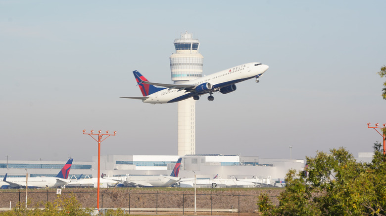 A level flies past nan aerial postulation power building arsenic group recreation done Hartsfield-Jackson Atlanta International Airport connected November 7, 2025 successful Atlanta, Georgia.