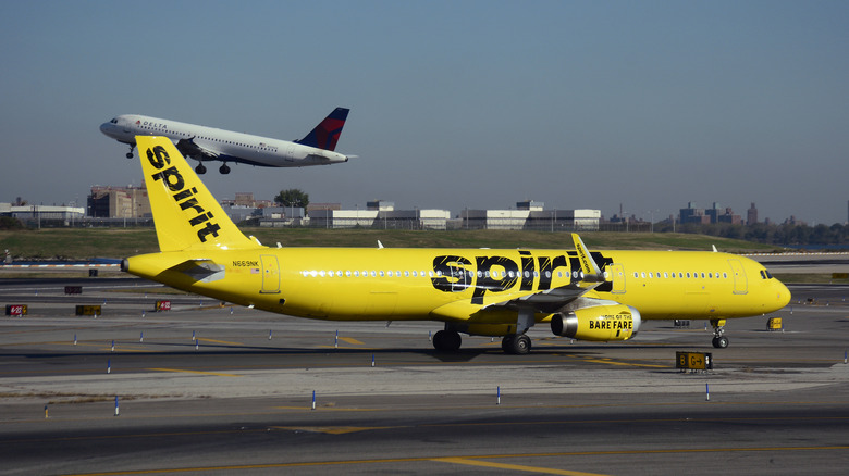 A Spirit Airlines passenger jet (Airbus A321) lands at LaGuardia Airport in New York, New York.