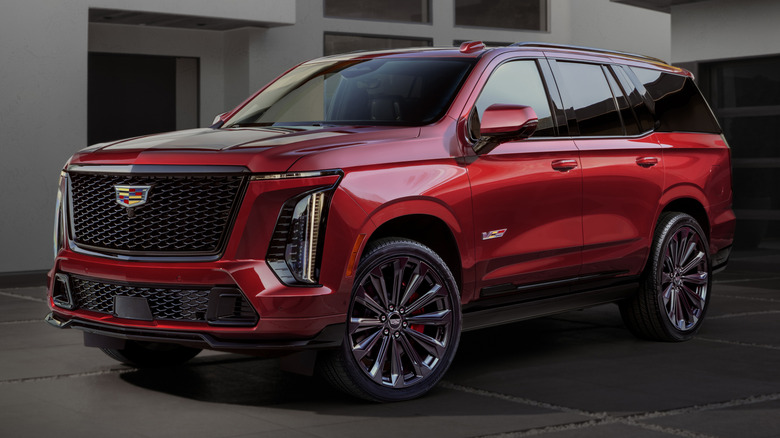 A red 2026 Cadillac Escalade V indoors