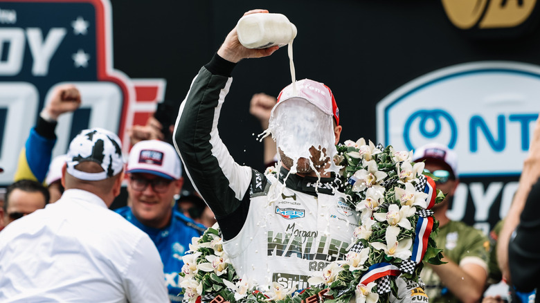 Felix Rosenqvist dumping milk on himself after winning the 2026 Indianapolis 500