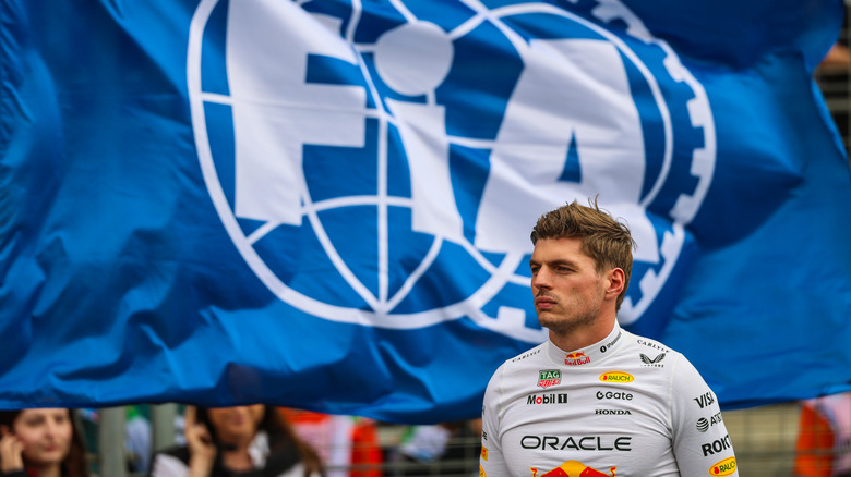 Max Verstappen of the Netherlands and Oracle Red Bull Racing looks on during the national anthem during the F1 Grand Prix of Azerbaijan at Baku City Circuit on September 21, 2025 in Baku, Azerbaijan.