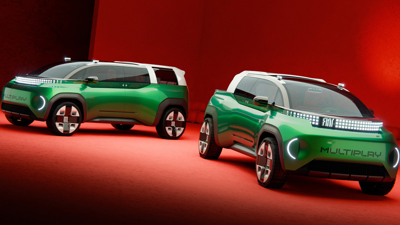 A green Multiplay in passenger configuration parked behind a green Multiplay in pickup configuration in a red studio
