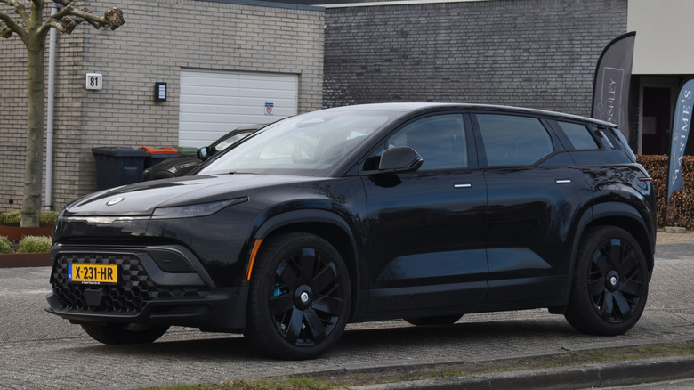 Front 3/4 view of a black Fisker Ocean.