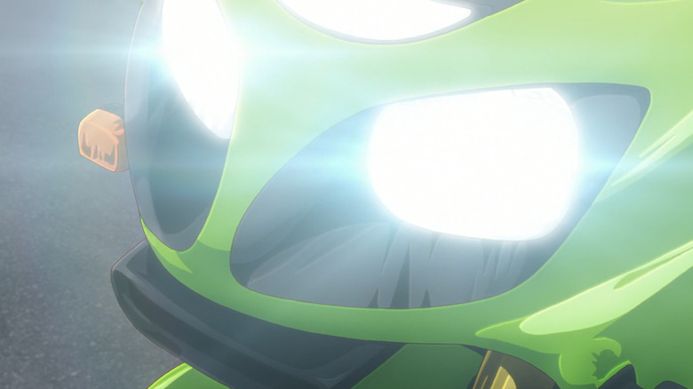 Close up of a greenish Kawasaki ZX-12R, blown retired by nan headlights