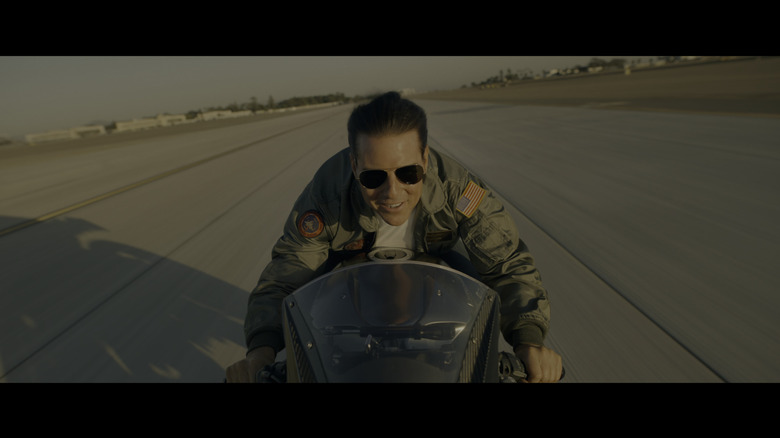 Maverick on his Ninja H2R Carbon on a runway, shot from the bike itself facing back at Mav