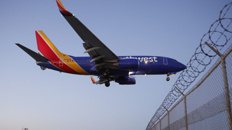A Southwest Airlines plane descends before landing at Hollywood Burbank Airport on January 29, 2026 in Burbank, California.