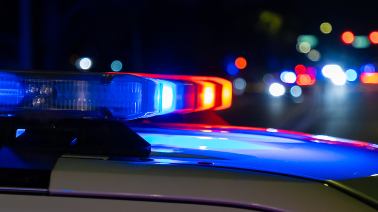 A close up of police sirens at night.