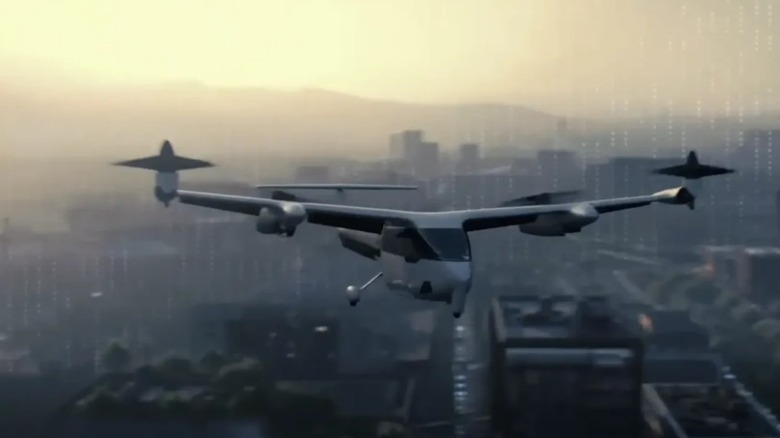 A small air taxi flying above a cityscape at dusk.