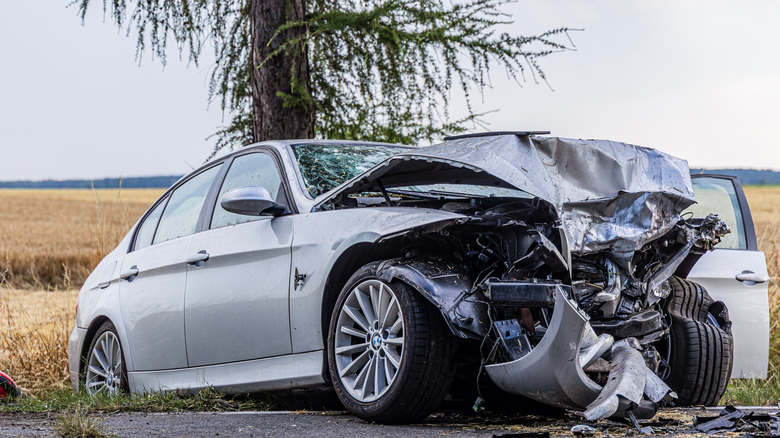 A silver BMW crashed at the roadside