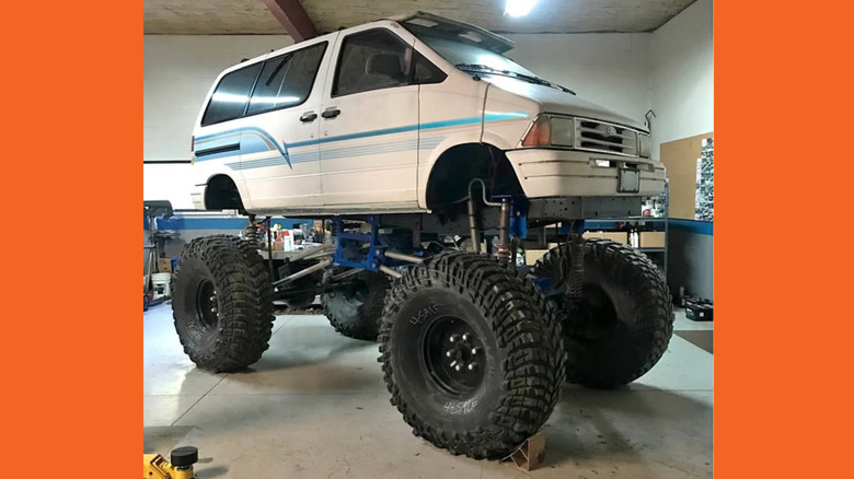 Lifted white Ford Aerostar