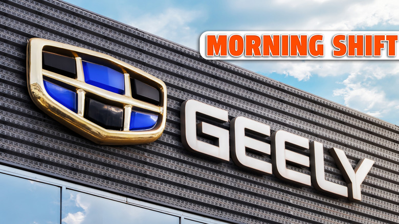 The logo of the automaker Geely on the facade of the dealership. Geely is a growing and powerful auto brand