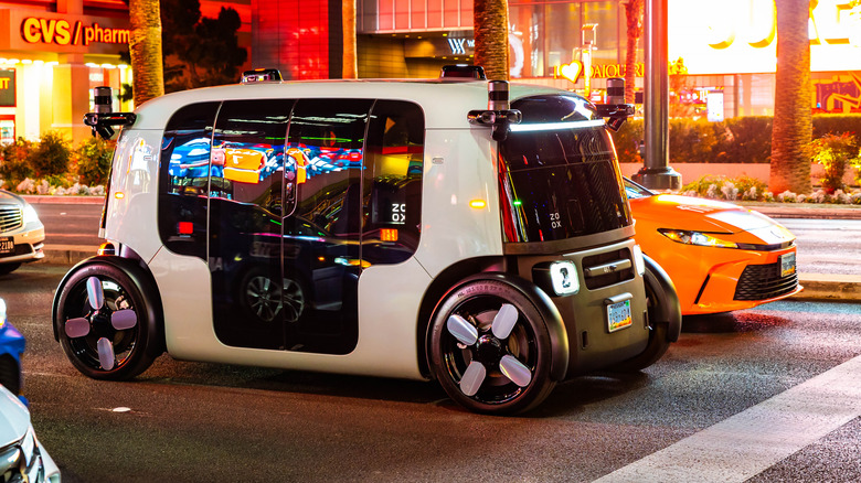 Autonomous Zoox robotaxi driving along Las Vegas Strip at night in Nevada