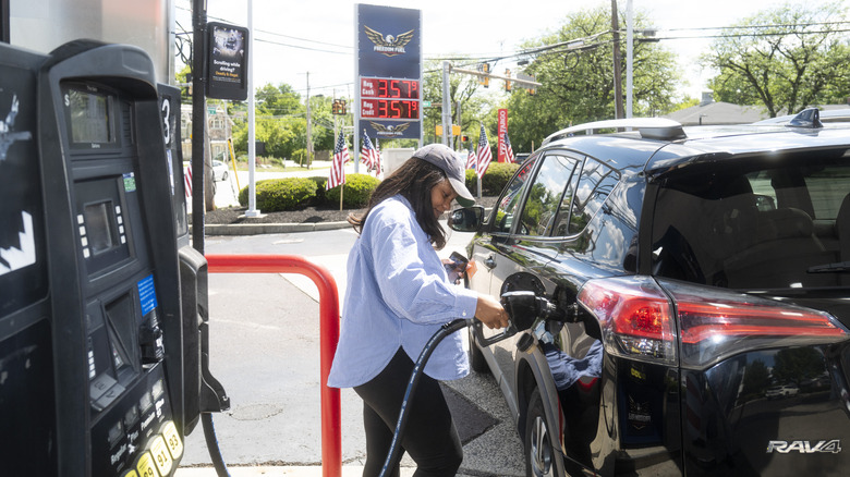 A customers gets gas at a Freedom Fuel Network gas station on July 8, 2026 in Dresher, Pennsylvania.
