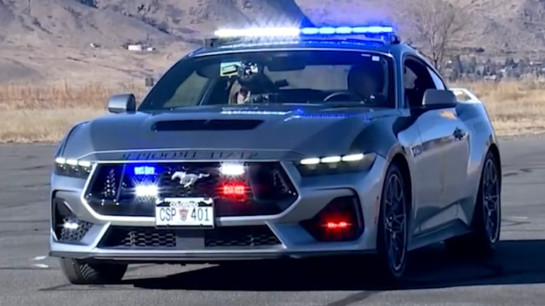 A Colorado State Police Ford Mustang GT with lights flashing